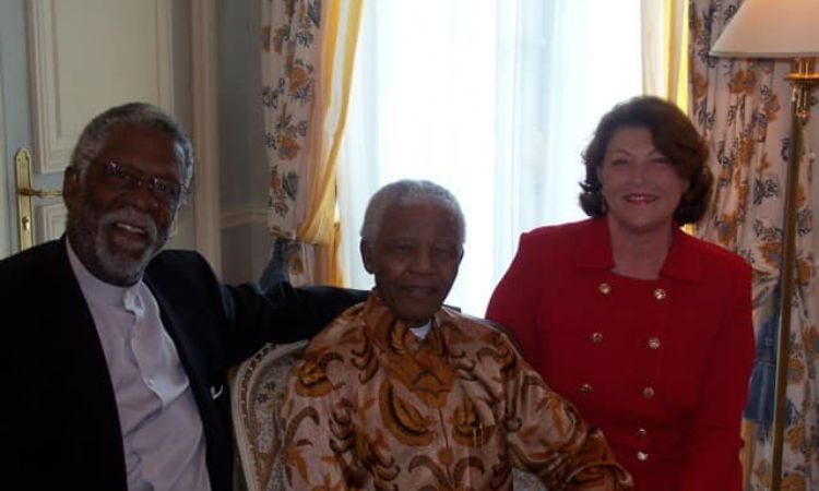 A picture of Marilyn Nault with Nelson Mandela and her husband Bill Russell. 
